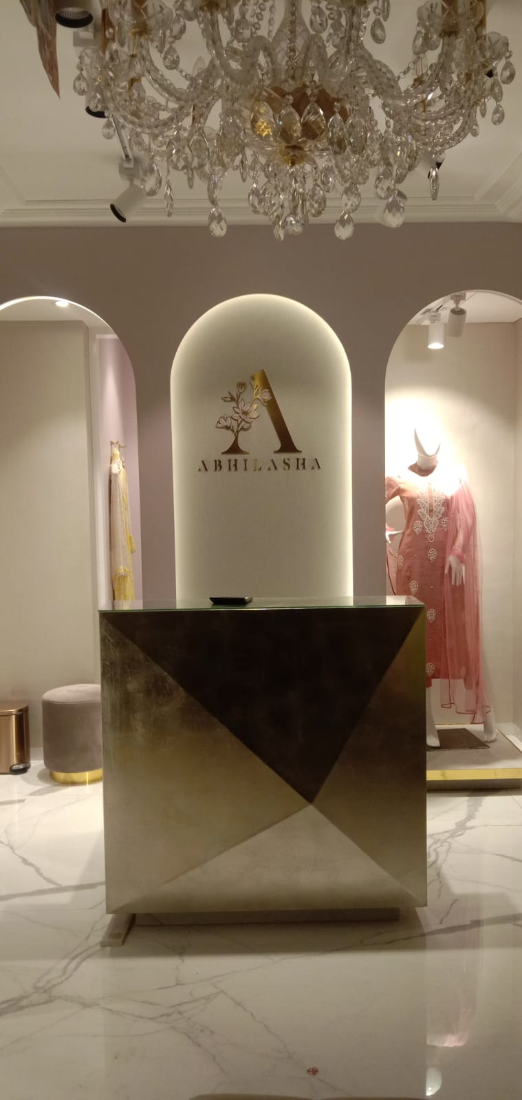 Geometric Faceted Reception Counter & Backlit Logo